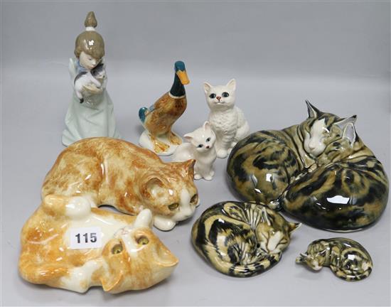 A collection of Winstanley, Beswick and other cats, etc.
